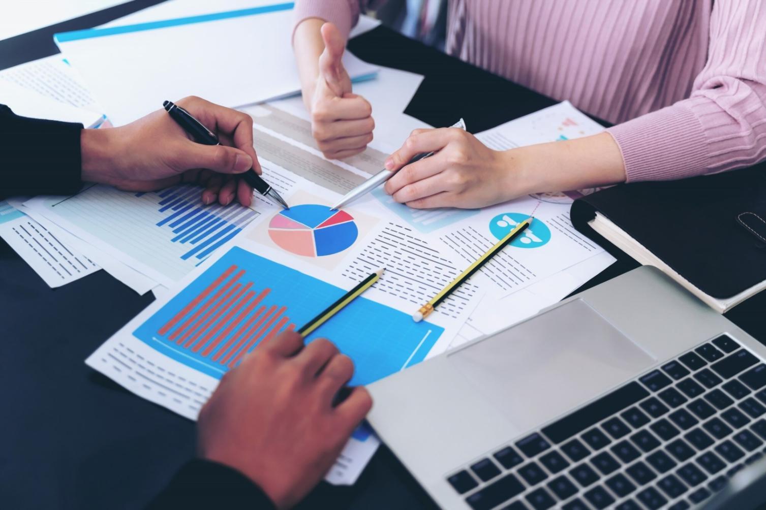 Early startup workspace with founders planning their fundraising strategy